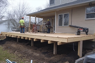 Deck construction project in progress on residential home