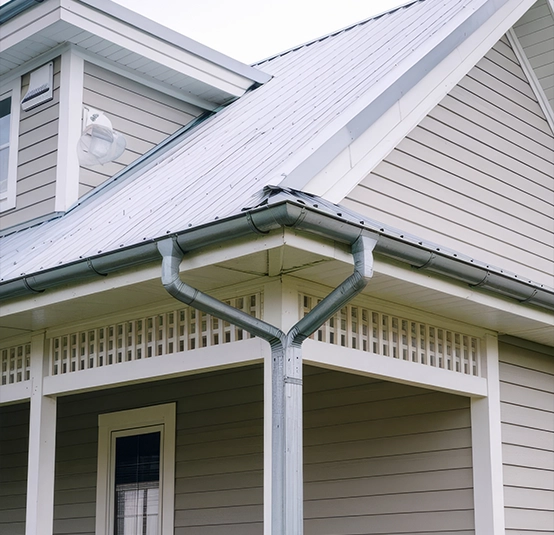 Metal roof installation on home exterior