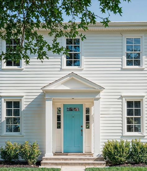 Home exterior with vinyl siding and windows