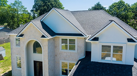 Residential home with new asphalt shingle roofing