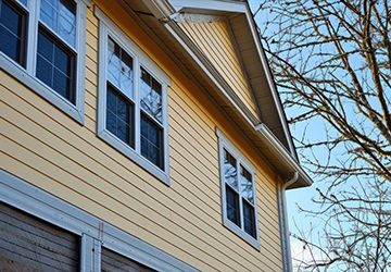 Vinyl siding installation on residential home exterior